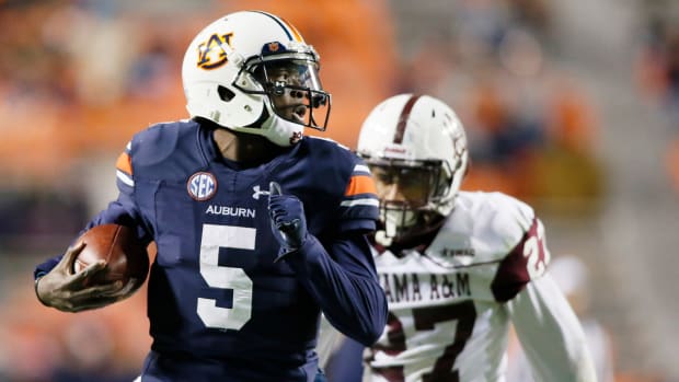 Nov 19, 2016; Auburn, AL, USA; Auburn Tigers quarterback John Franklin (5) scores a touchdown during the third quarter against the Alabama A&M Bulldogs at Jordan Hare Stadium. Mandatory Credit: John Reed-USA TODAY Sports